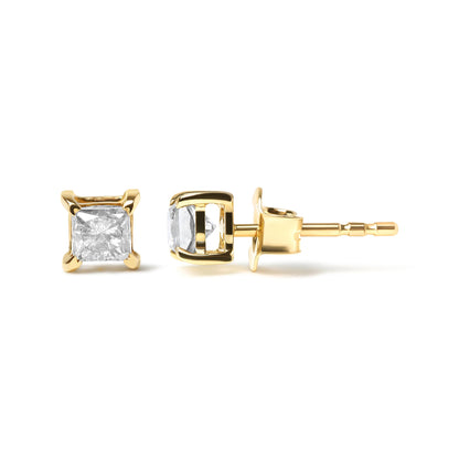 Pair of yellow metal stud earrings with white princess-shaped gemstones in four-prong settings, shown from front and side angles on a white background.