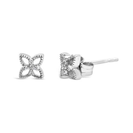 Pair of white metal stud earrings with open petal-like shapes and round white gemstones in prong settings, shown front and side angles on a white background.