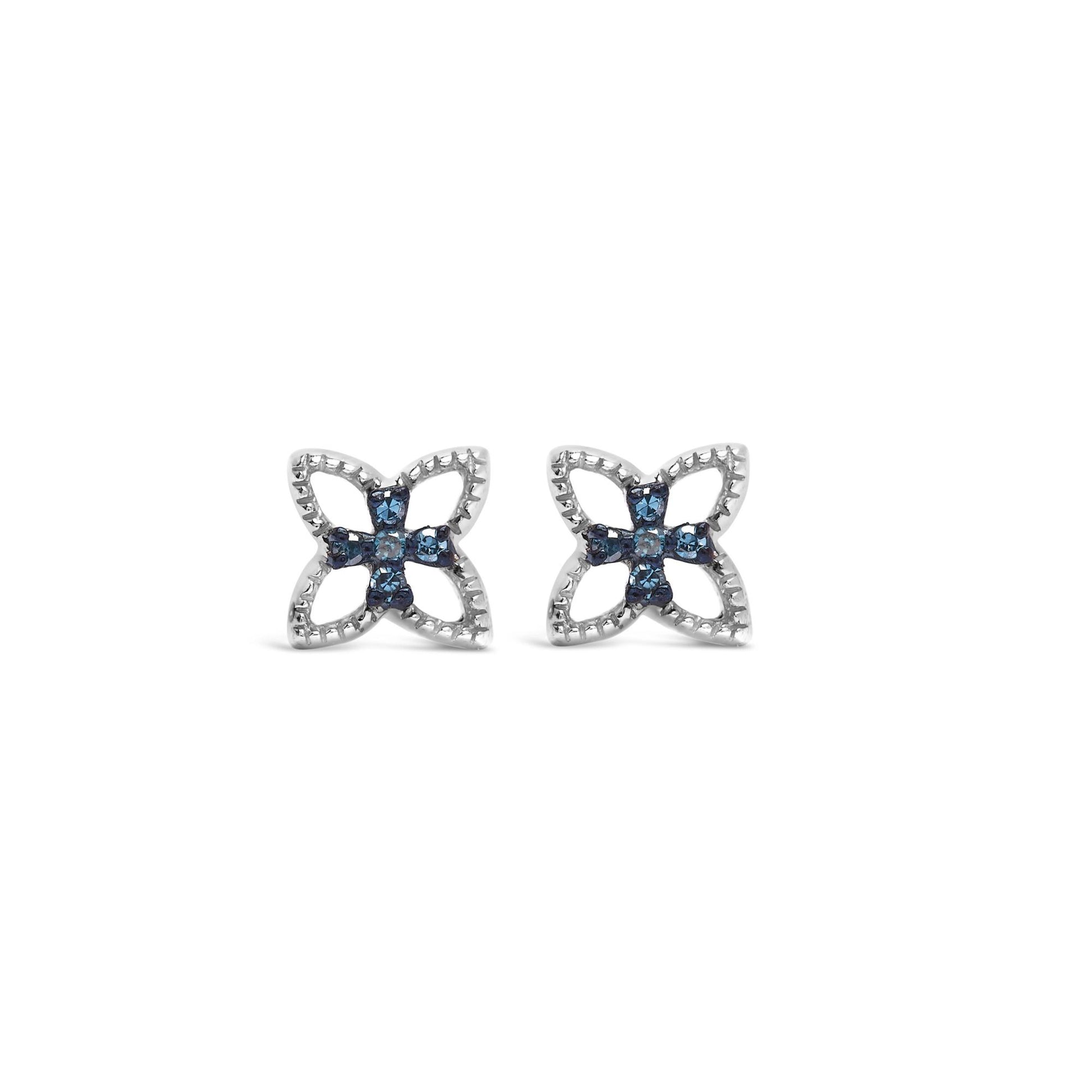 Pair of white metal earrings with a floral design featuring round blue gemstones in prong settings, shown from the front on a white background.