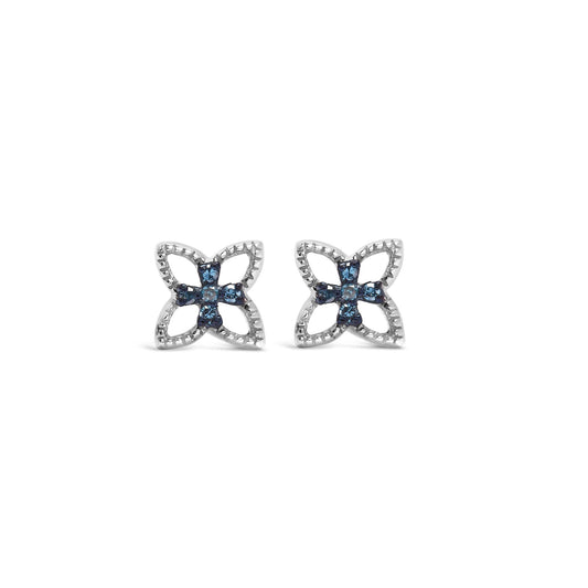 Pair of white metal earrings with a floral design featuring round blue gemstones in prong settings, shown from the front on a white background.