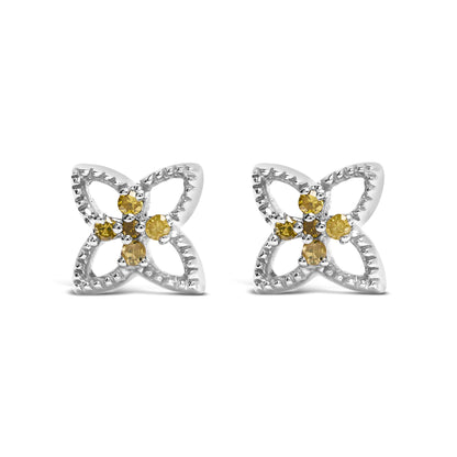 Pair of white metal earrings with open petal-shaped frames, each featuring clustered yellow round gemstones in prong settings, shown from a front angle.