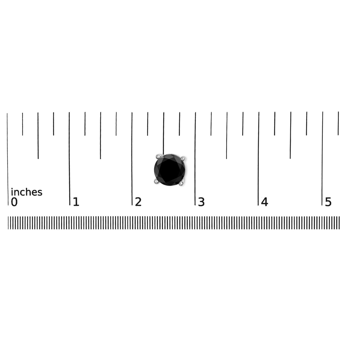 Close-up of a single white metal earring with a round black gemstone in a 4-prong setting, placed on a ruler for size reference, shot from above.