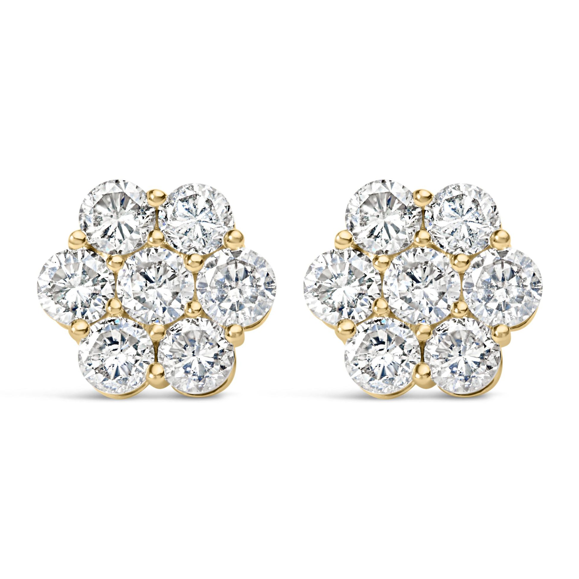 Front angle view of a pair of yellow metal earrings shaped like flowers, each featuring cluster of round white gemstones in prong settings.
