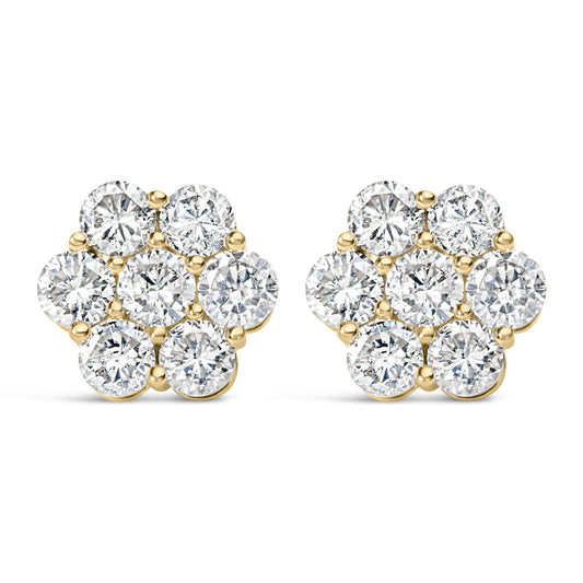 Front angle view of a pair of yellow metal earrings shaped like flowers, each featuring cluster of round white gemstones in prong settings.