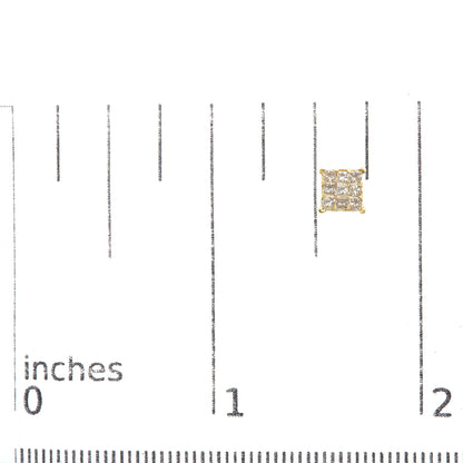 Close-up front view of a yellow metal stud earring with a square cluster of white princess-shaped gemstones in an invisible setting, placed on a ruler for size reference.