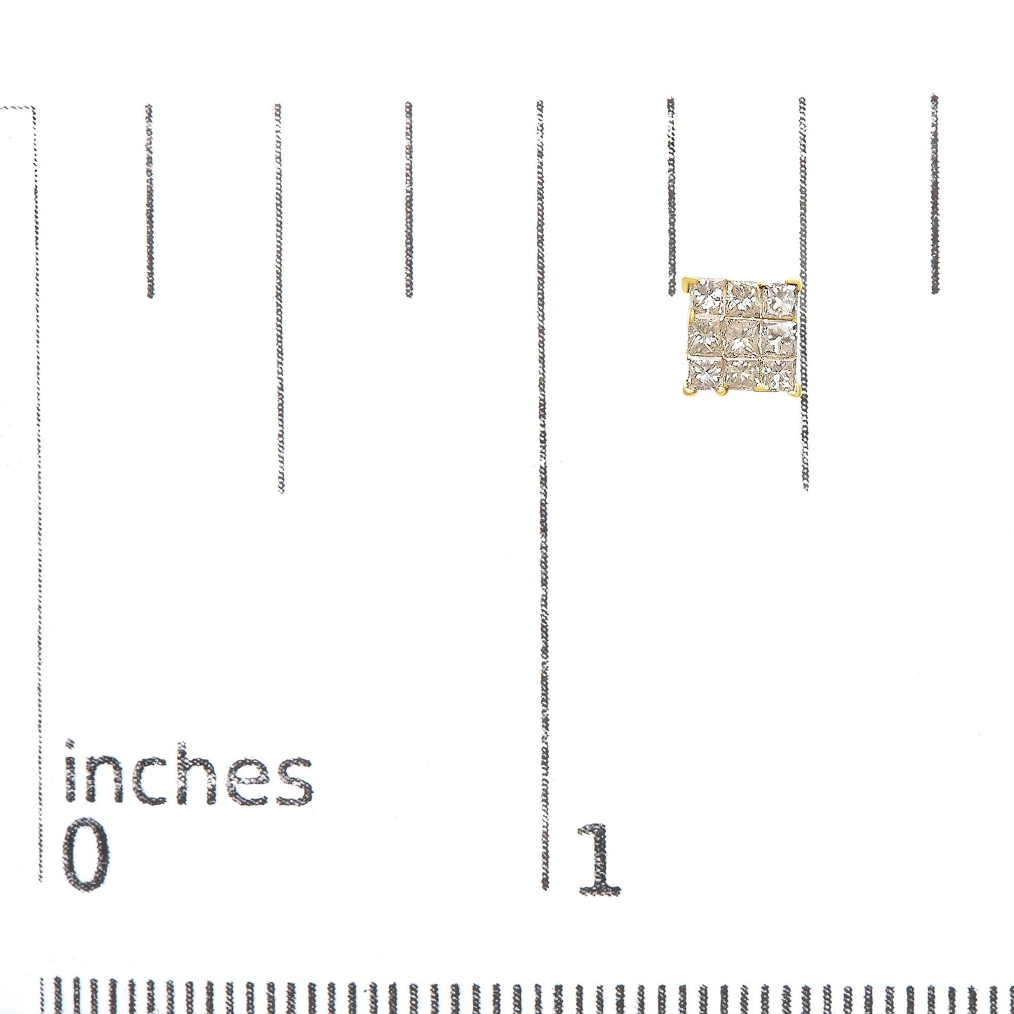 Close-up top-down view of yellow metal square-shaped earrings with white princess cut gemstones in invisible setting, placed on a ruler for size reference.