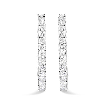 Close-up front view of white metal hoop earrings set with two rows of princess-shaped white gemstones in shared prong settings.