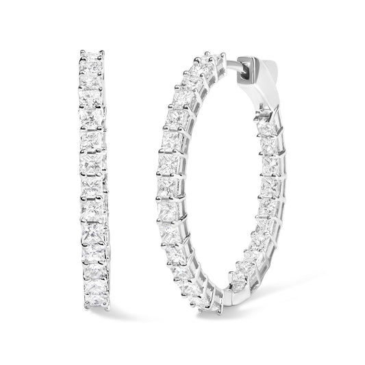 Close-up front and side view of a pair of white hoop earrings set with multiple white princess-shaped gemstones in shared prong settings.