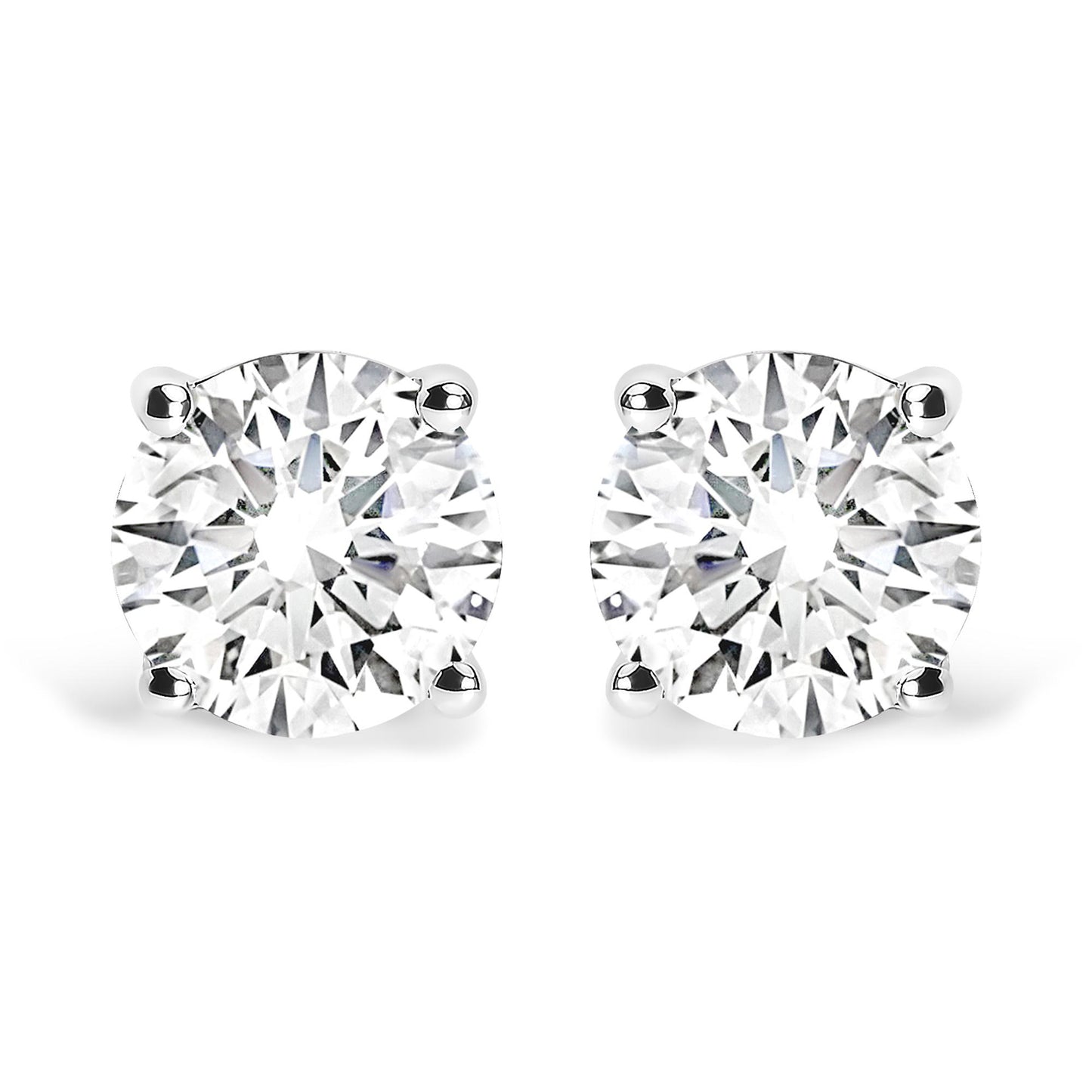 Front view of a pair of white metal stud earrings, each set with a round white gemstone in a four-prong setting.