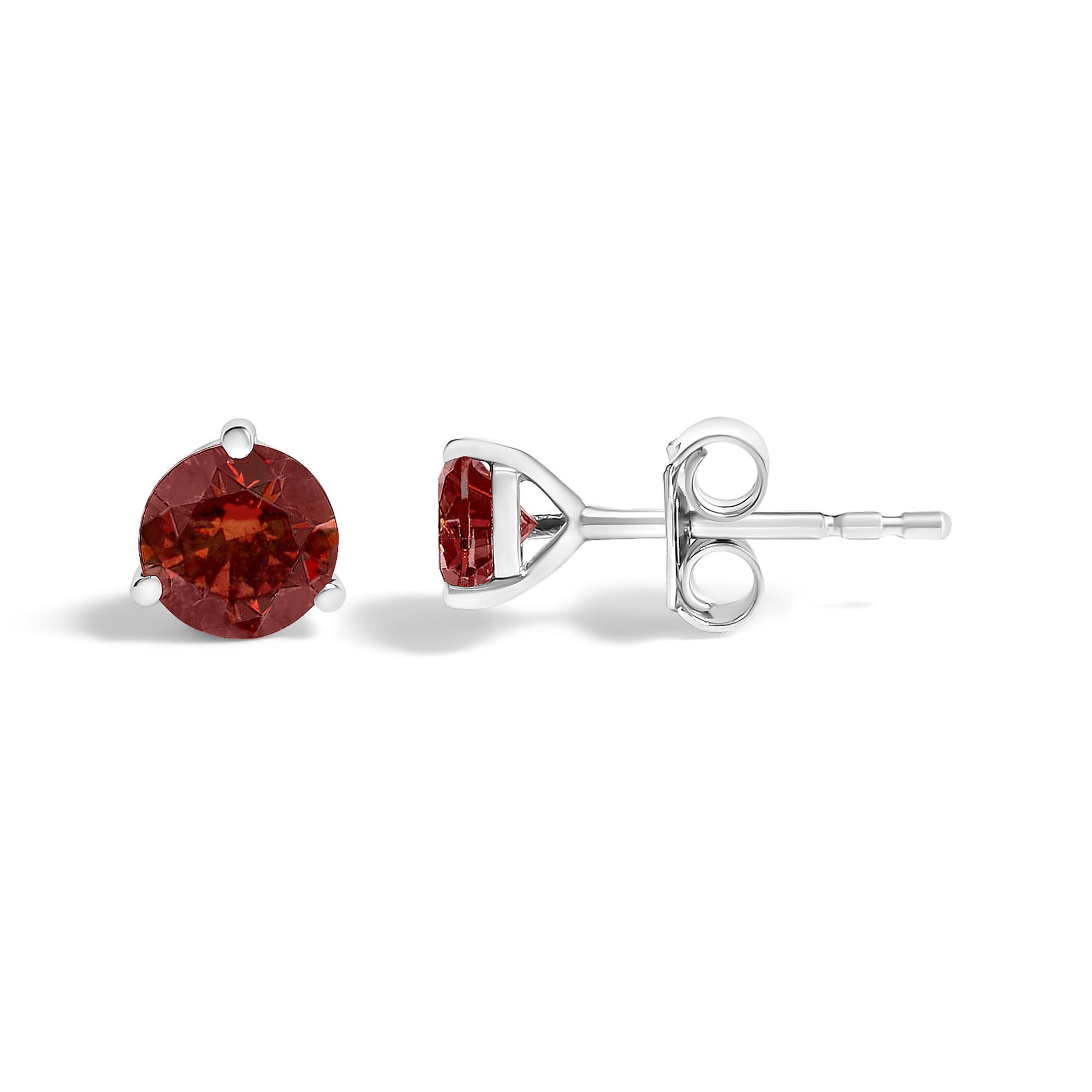 Pair of white metal stud earrings with round red gemstones in three-prong settings, shown at front and side angles on a white background.