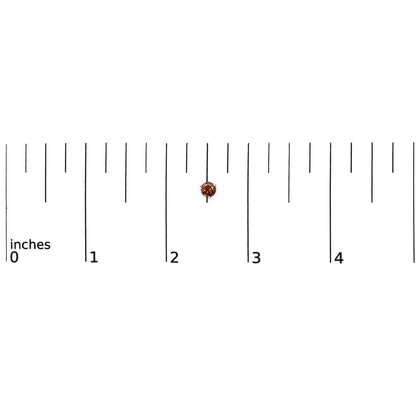 White metal stud earring with round red gemstone in 3-prong setting, shown on a ruler scale from top angle.