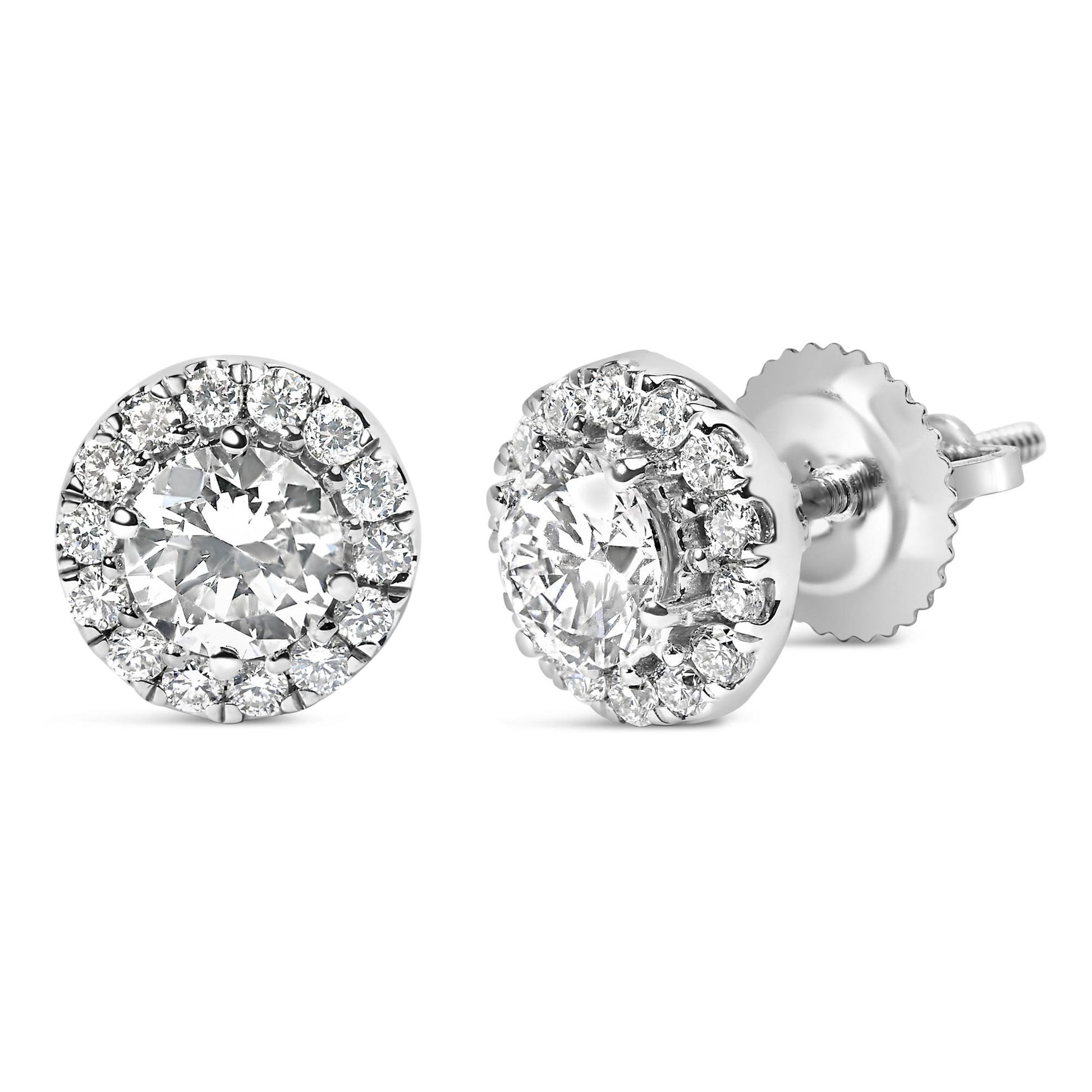 Close-up front and side angled view of white metal stud earrings featuring a central round white gemstone surrounded by a halo of smaller round white gemstones in prong settings.