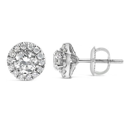 Pair of white metal stud earrings with round white gemstones in prong settings, shown from front and side angles.