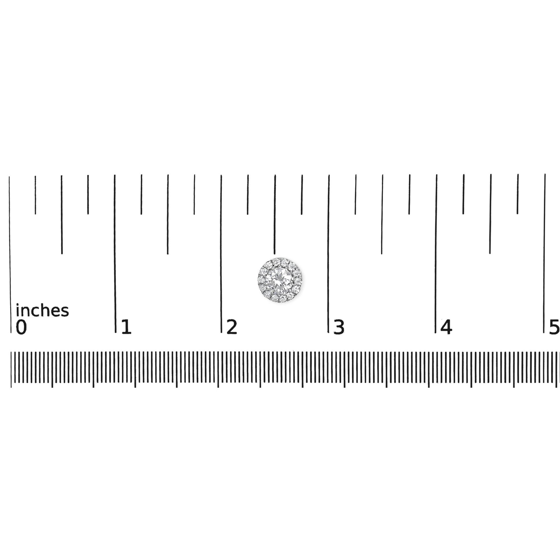 White metal round earrings with prong-set white gemstones in a cluster design, shown on a ruler for size reference, top-down angle.