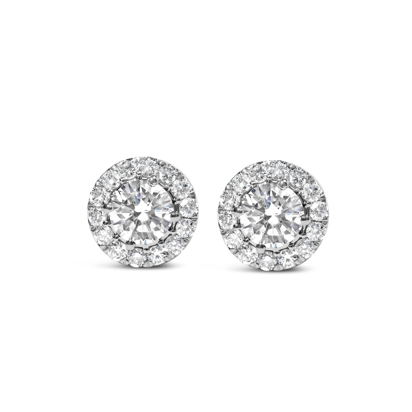 Front view of white metal round stud earrings with a large central white gemstone surrounded by a halo of smaller white gemstones.