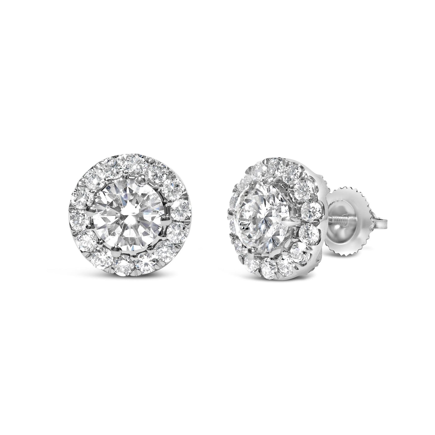 Pair of white metal stud earrings with round white gemstones in prong settings, shown in a front and side angle view.