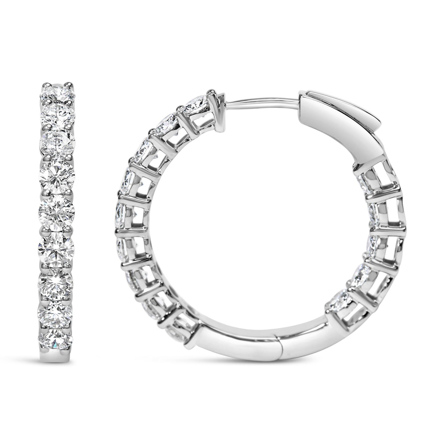 Front and side views of a pair of white metal hoop earrings with round white gemstones set in shared prong settings, shown on a white background.