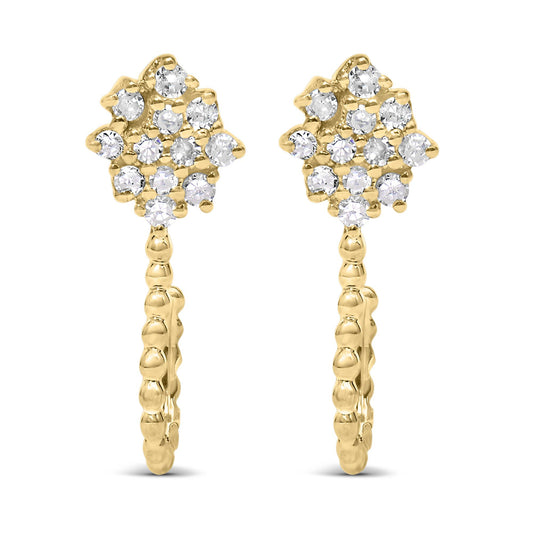 Front-facing view of a pair of yellow metal earrings featuring cluster arrangements of prong-set round white gemstones at the top and a textured hoop design below.