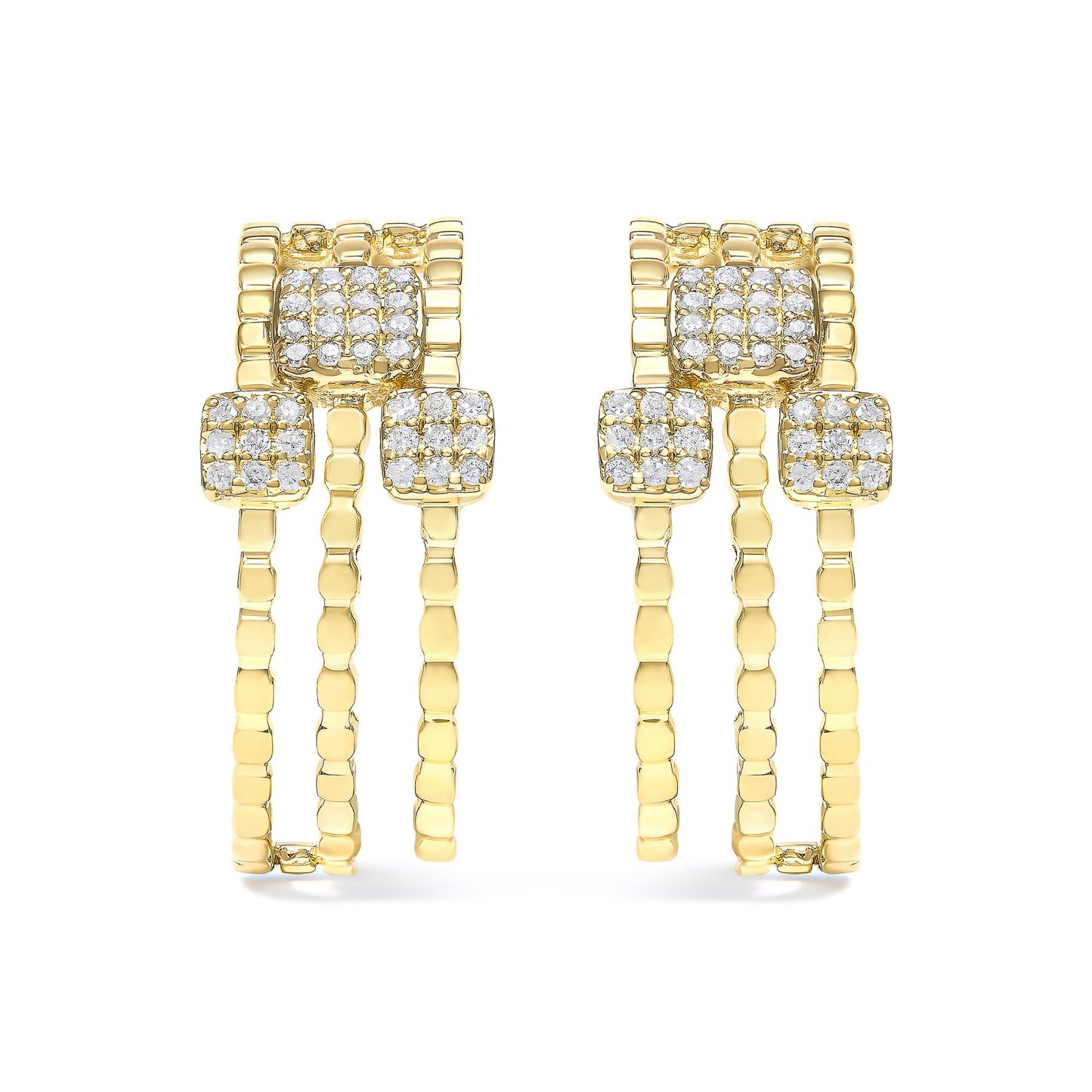 Pair of yellow metal earrings with multiple round white gemstones set in prongs, shown from the front angle.