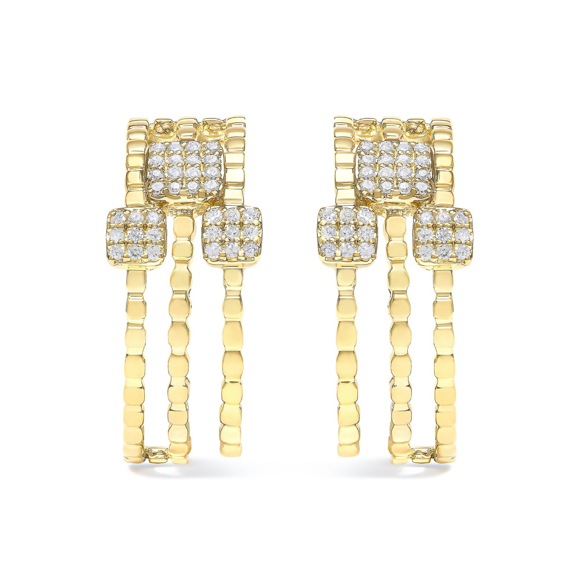 Pair of yellow metal earrings with multiple round white gemstones set in prongs, shown from the front angle.