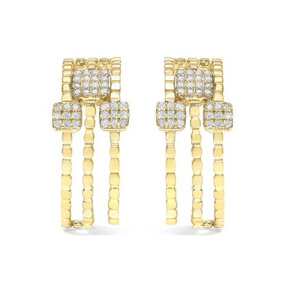 Pair of yellow metal earrings with multiple round white gemstones set in prongs, shown from the front angle.