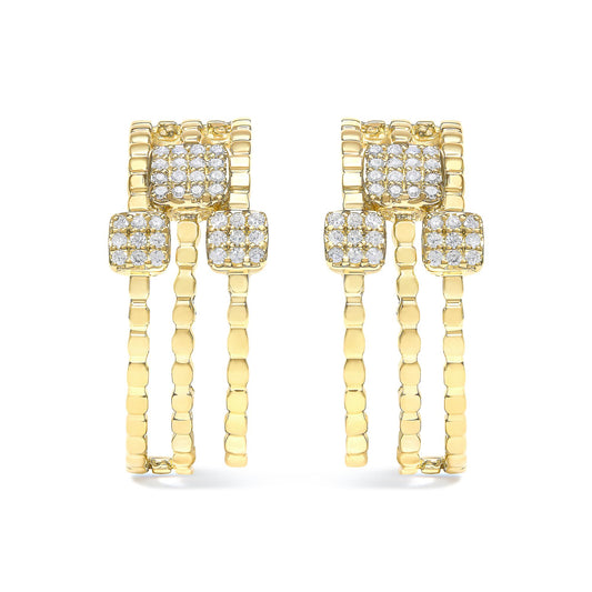 Pair of yellow metal earrings with multiple round white gemstones set in prongs, shown from the front angle.