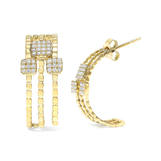 Pair of yellow metal earrings with three curved bands and square clusters of white gemstones, shown from front and side angles on a white background.