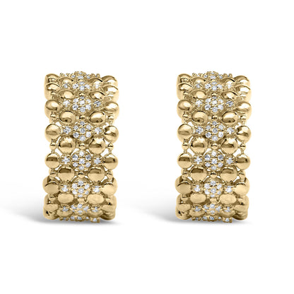 Close-up front view of a pair of yellow metal earrings featuring clusters of round white gemstones in prong settings surrounded by smooth metal beads.