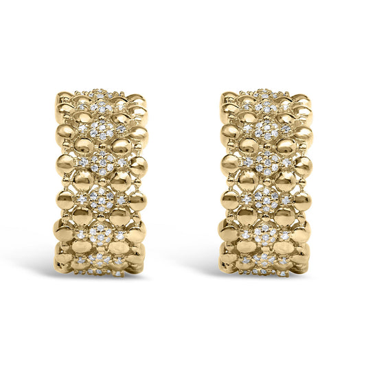Close-up front view of a pair of yellow metal earrings featuring clusters of round white gemstones in prong settings surrounded by smooth metal beads.