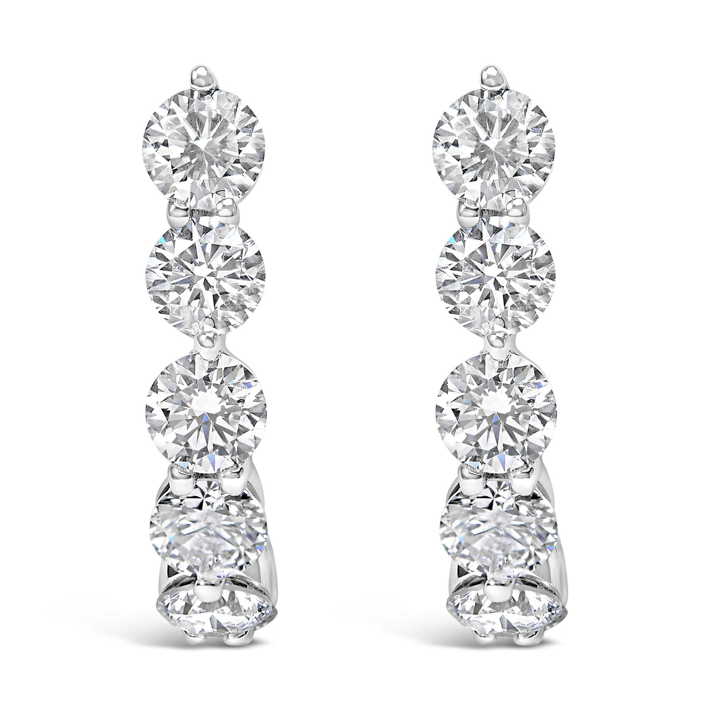 Front view of white metal earrings featuring a vertical row of round white gemstones in prong settings.