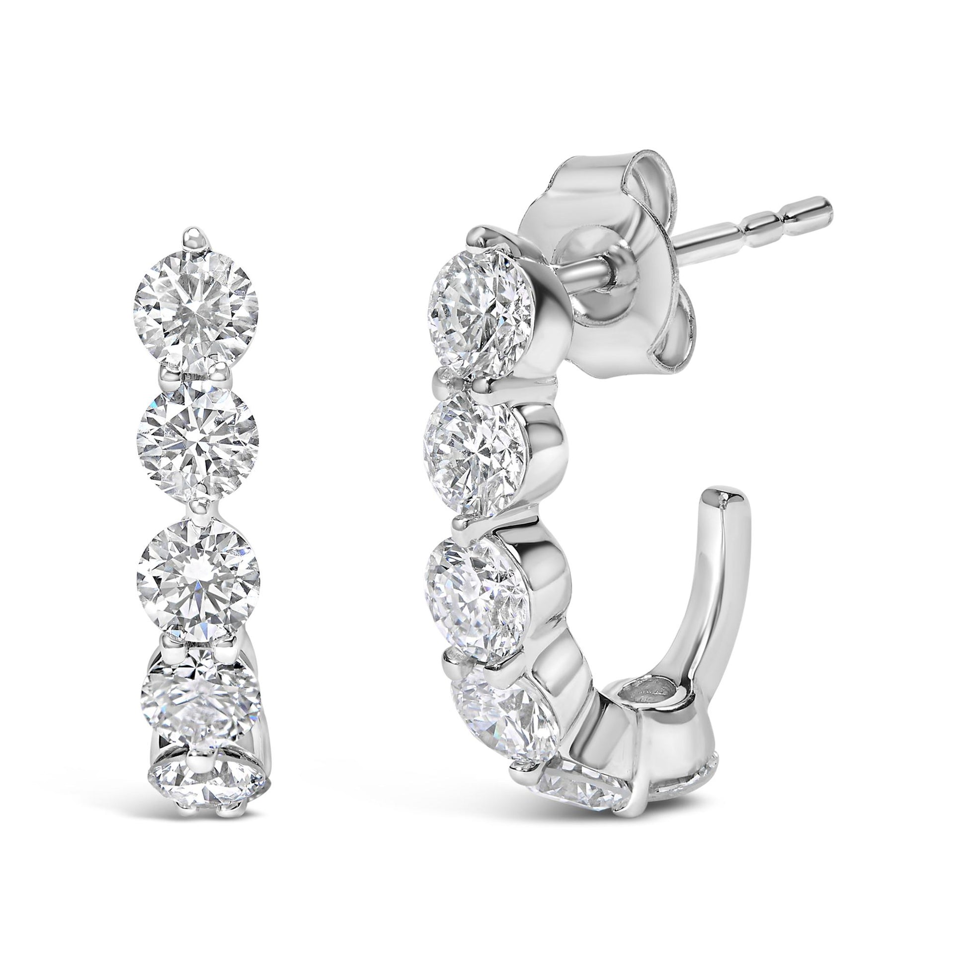 Pair of white metal hoop earrings with round white gemstones in prong settings, shown from front and side angles.