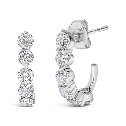 Pair of white metal hoop earrings with round white gemstones in prong settings, shown from front and side angles.