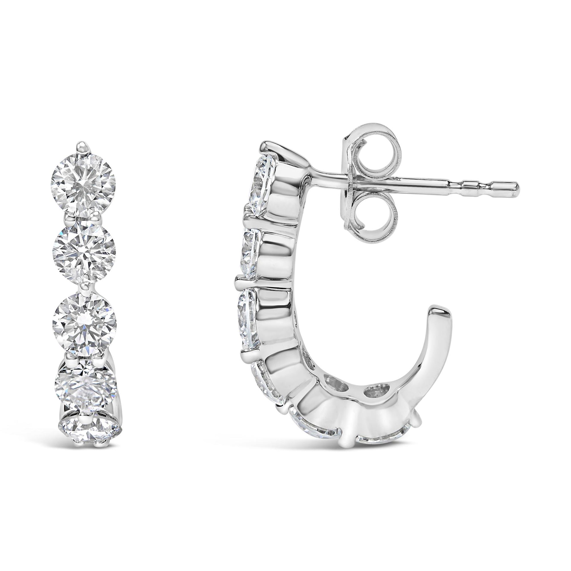 Pair of white metal earrings with round white gemstones in prong settings, shown from front and side angles on a white background.