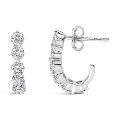 Pair of white metal earrings with round white gemstones in prong settings, shown from front and side angles on a white background.
