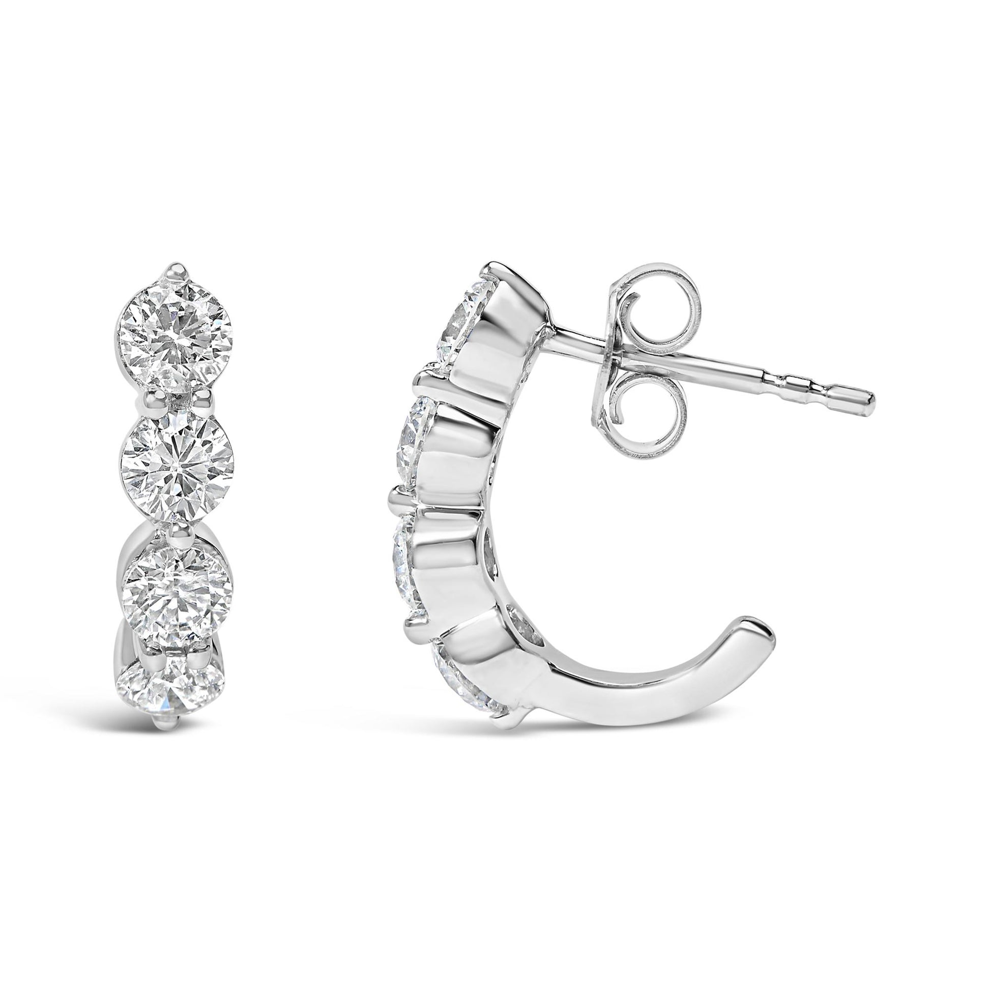 Front and side angled view of white metal earrings featuring round white gemstones in prong settings arranged vertically.