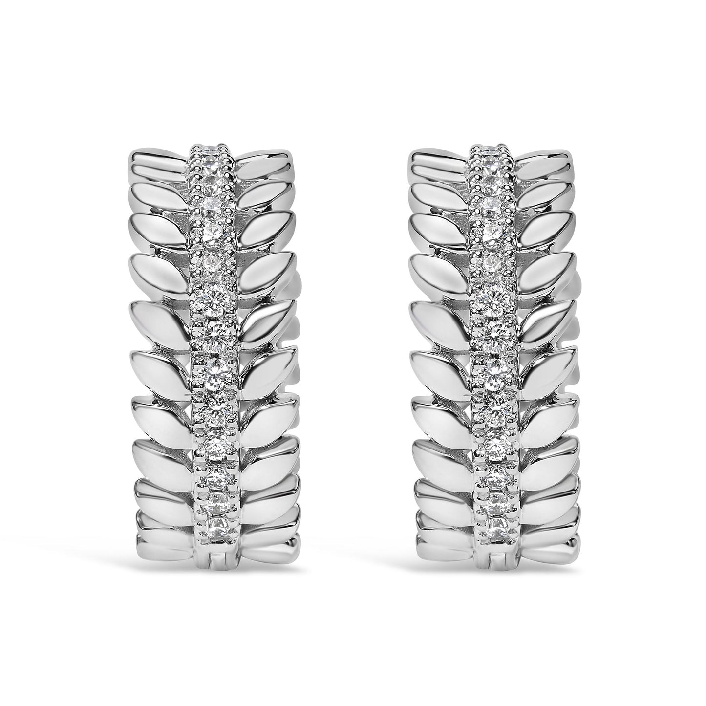 Front-facing view of white metal hoop earrings with a central row of round white gemstones in prong settings, flanked by a leaf-like design on both sides.
