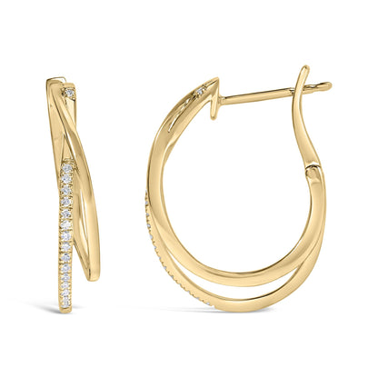 Close-up front and side view of yellow metal hoop earrings with twisted design adorned with white round gemstones in prong settings.