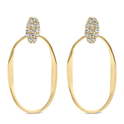 Front view of yellow metal open oval hoop earrings with pavé set white round gemstones on the top section.