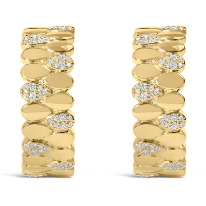 Front view of a pair of yellow metal earrings featuring an alternating pattern of smooth segments and segments set with round white gemstones in prong and pave settings.