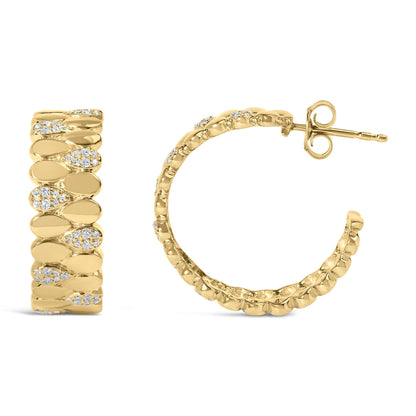 Front and side view of yellow metal hoop earrings with round white gemstones in prong and pave settings, photographed on a white background.