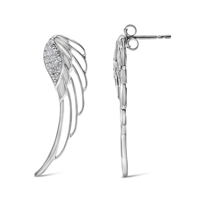 Pair of white metal earrings shaped like wings with white round gemstones in prong setting, shown from front and side angles.