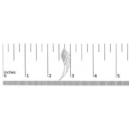 White metal earring with curved openwork design and cluster of round white gemstones, shown from front on a ruler for size reference.