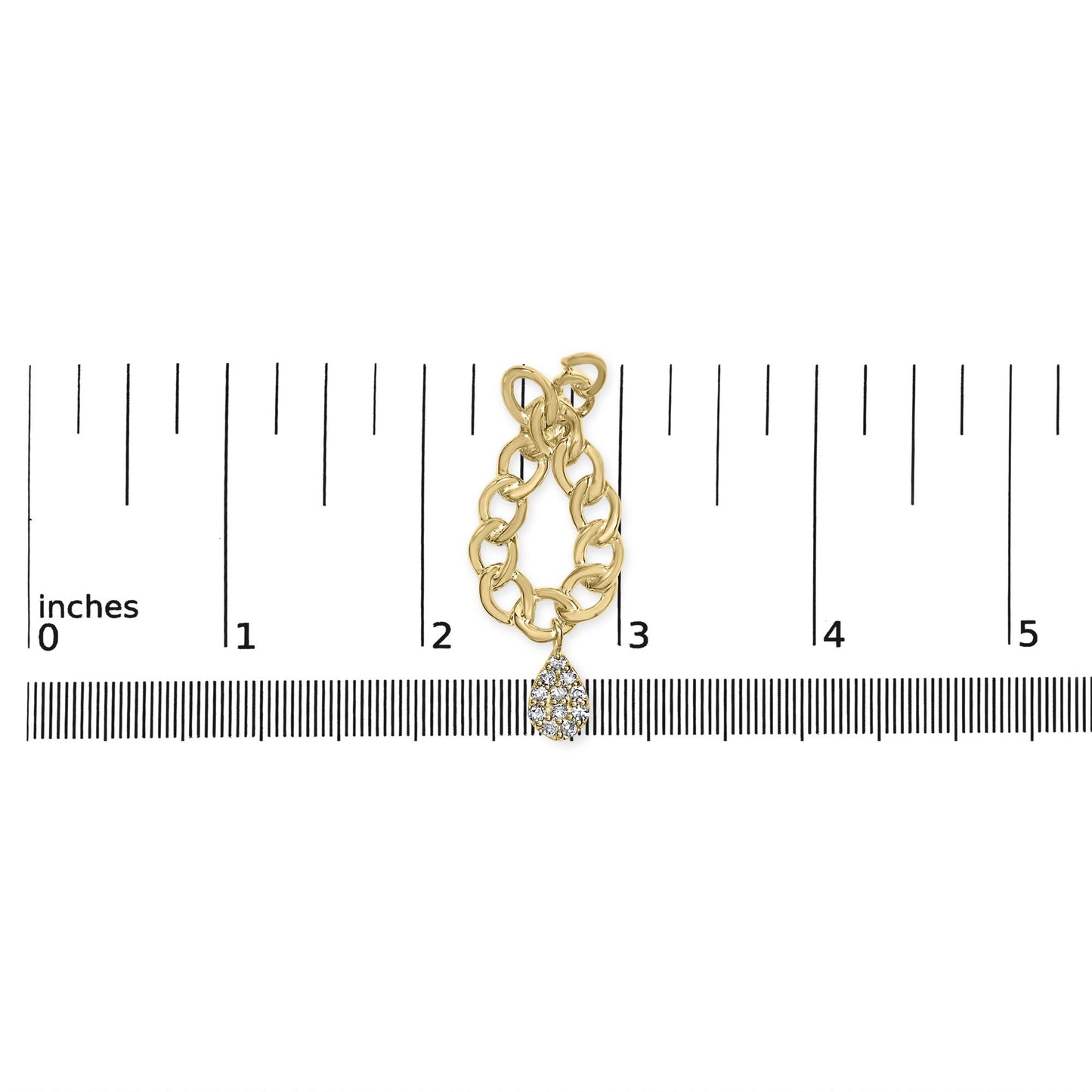 Yellow metal chain-link earring with a teardrop-shaped cluster of white gemstones, shown on a ruler for size reference, top-down angle.