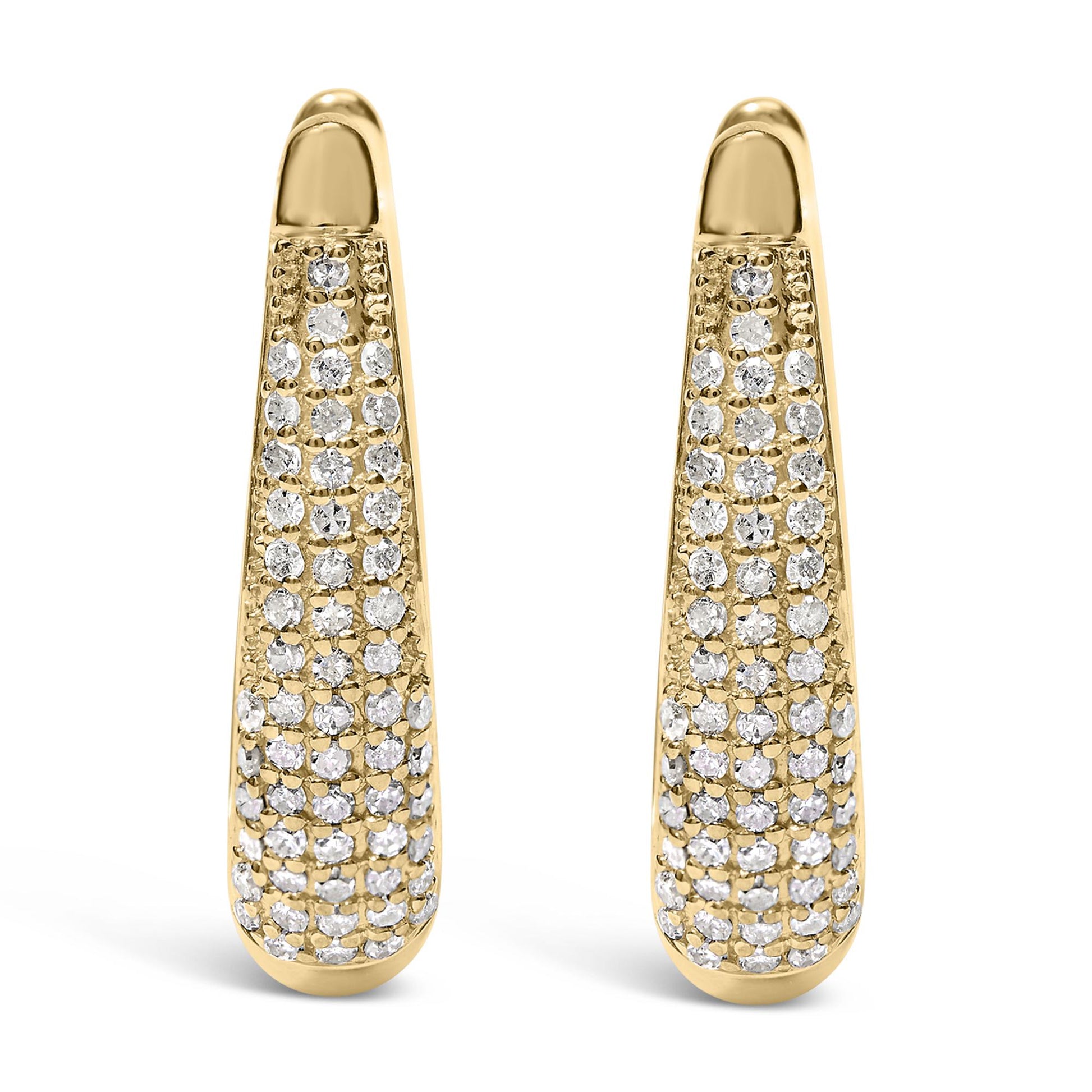 Front-facing view of a pair of yellow metal earrings with pave-set round white gemstones covering the lower length of each earring.
