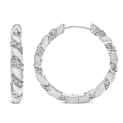 Pair of white metal hoop earrings with alternating smooth and textured sections set with small round white gemstones, shown from front and side angles.