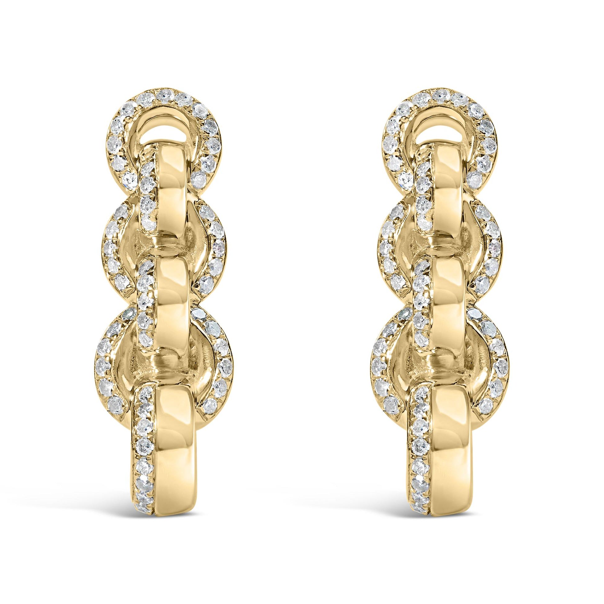 Front view of a pair of yellow metal chain link earrings adorned with round white gemstones in prong settings.