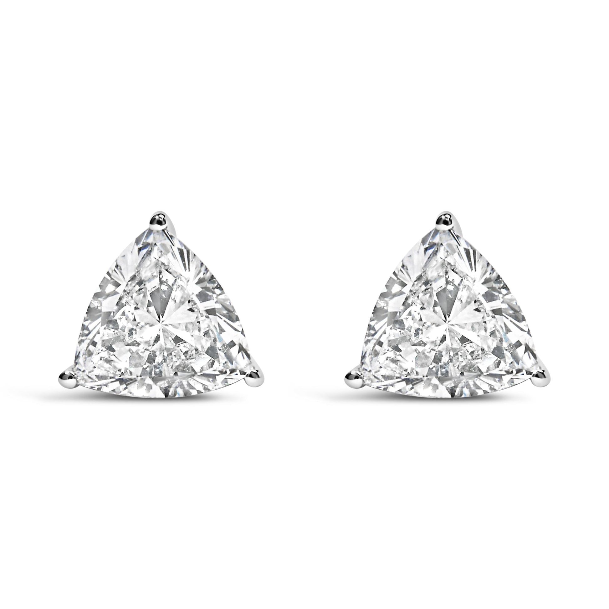 Pair of white metal stud earrings with trillion-shaped white gemstones in three-prong settings, shown from the front on a white background.