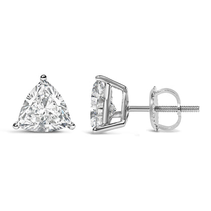 Close-up of a pair of white metal earrings with triangular white gemstones in 3-prong settings shown from front and side angles.