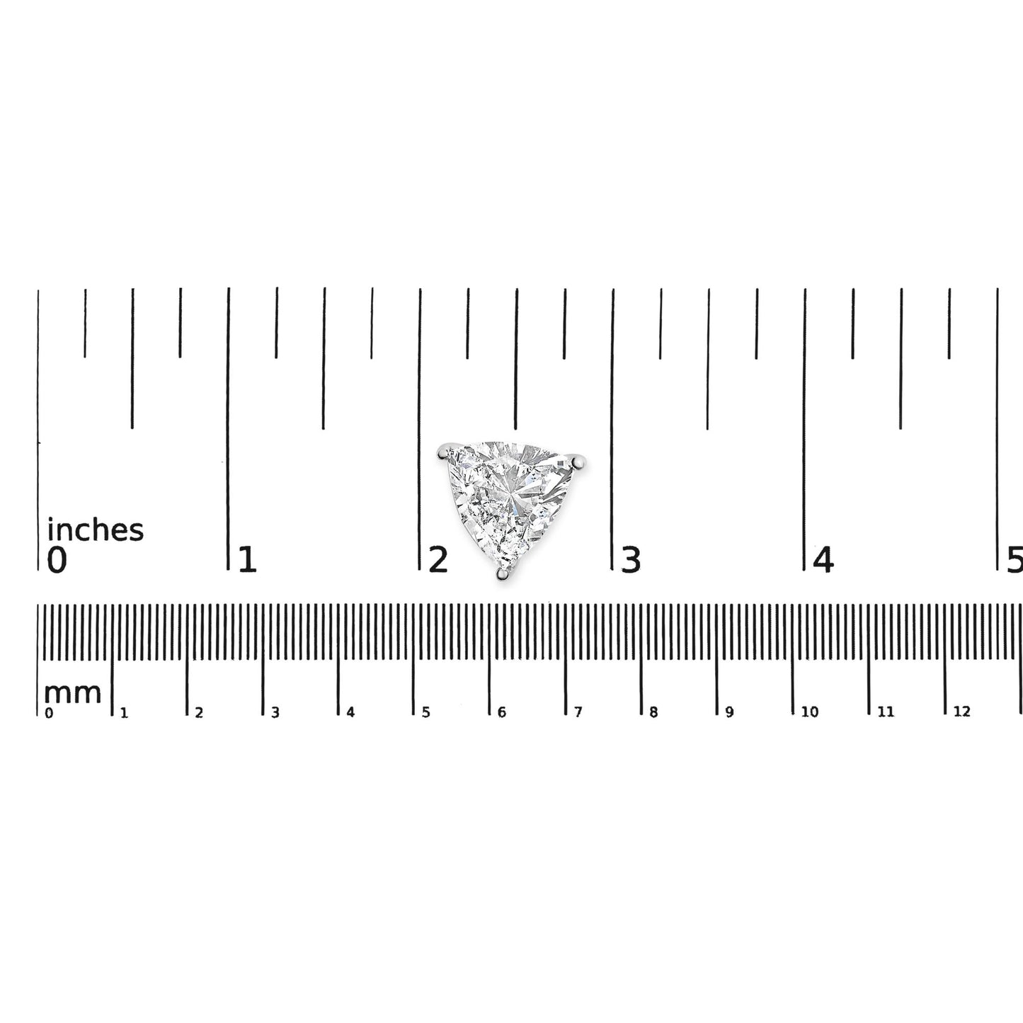 Close-up shot of a single white metal earring with a trillion-shaped white gemstone in a 3-prong setting, placed on a ruler for size reference.