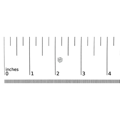 Close-up top view of a single white metal stud earring with a round white gemstone in 3-prong setting, placed on a ruler for size reference.